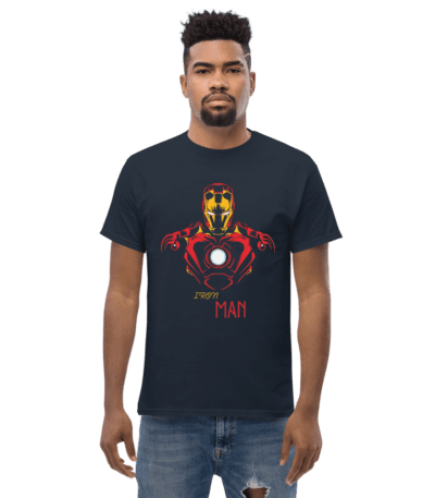 A man wearing a navy blue Iron Man Superhero Illustration Tee featuring a bold red and gold armor graphic with a glowing arc reactor.