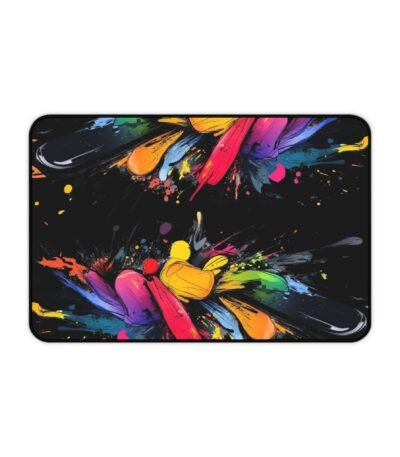 A vibrant Abstract Rainbow Splash Desk Mat featuring high-definition multi-colored paint splatters against a deep black background.